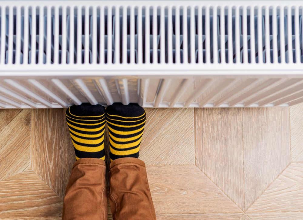 Feet resting on a warm radiator