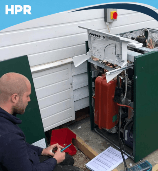 HPR Services engineer with an oil boiler in Gloucester